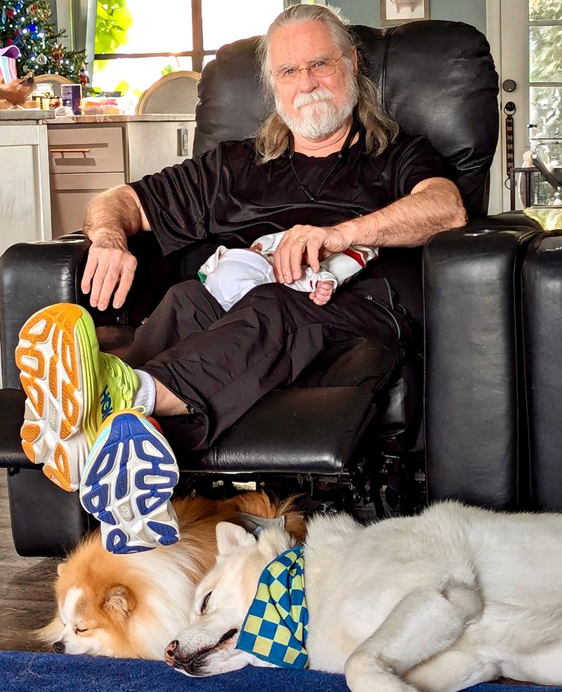 Proud grandfather with Baby Riley and some of the family doggies...