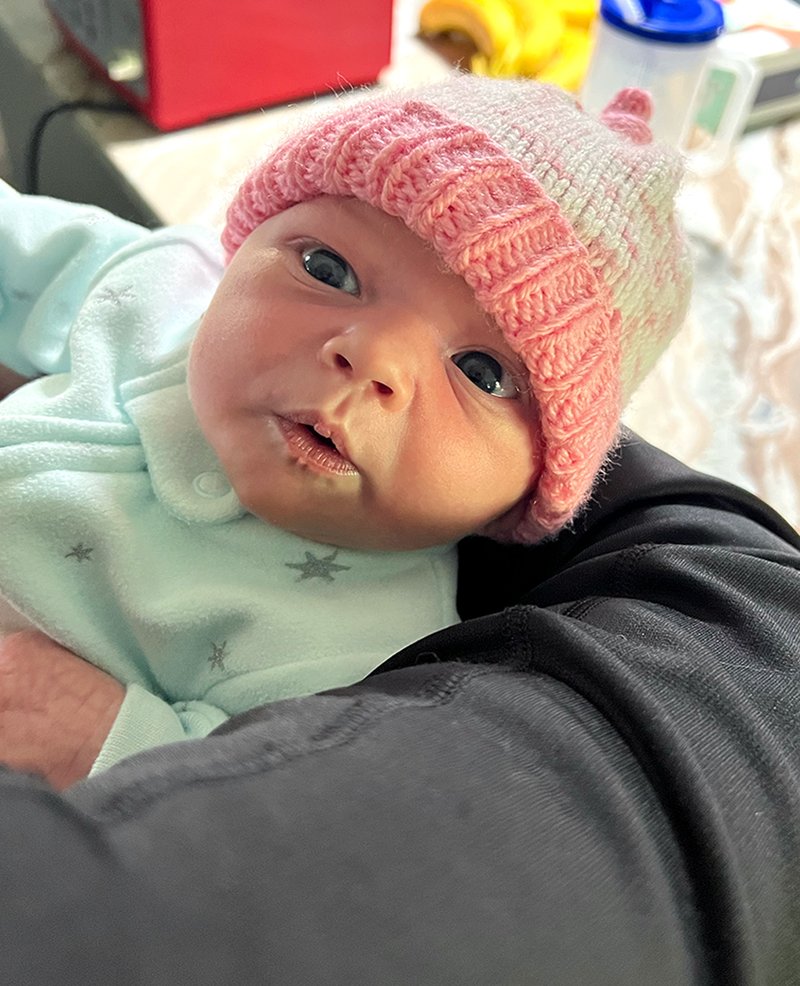 Tiny Riley dressed for Florida winter a few days old ❤️❤️